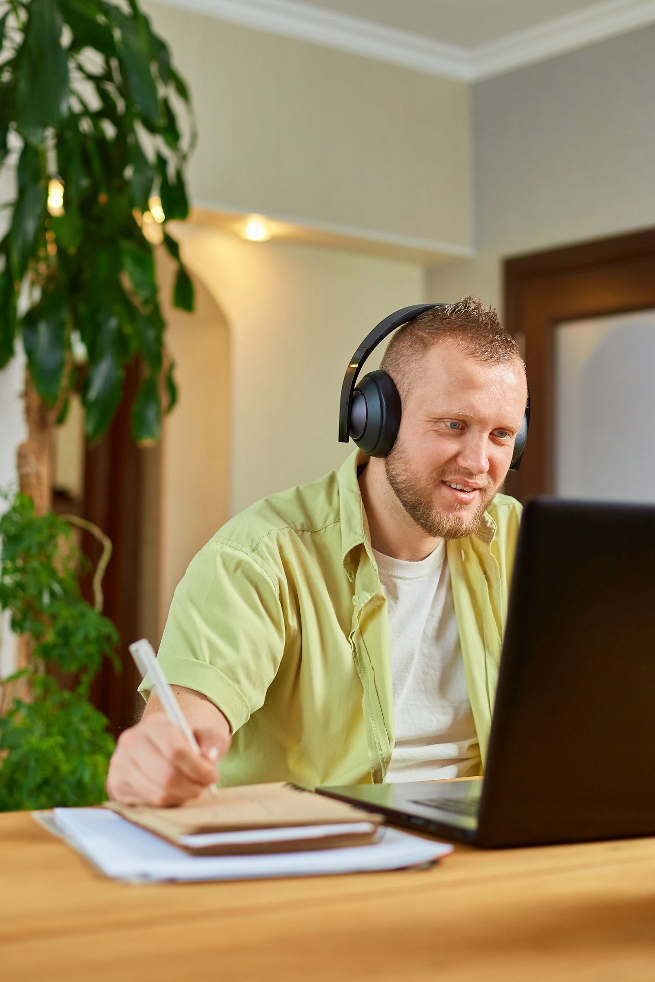 Happy Man wearing wireless headphones watch webinar, trainning, course